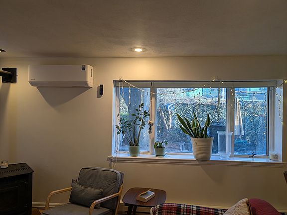 Living room window to the backyard. minisplit provides AC and heat