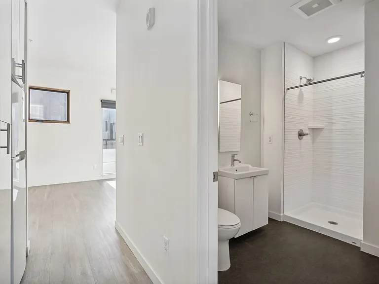 Hallway with Built-in storage and Washer/Dryer in cabinets