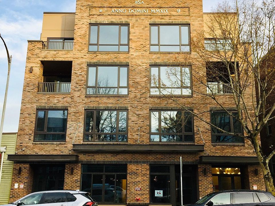 Classic brick facade, facing California Ave SW, new construction