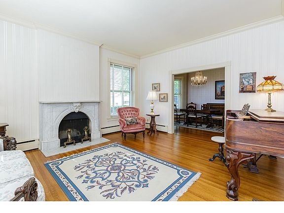 Living Room with 10 Foot Ceilings, Fireplace and Original Hardwood Floors