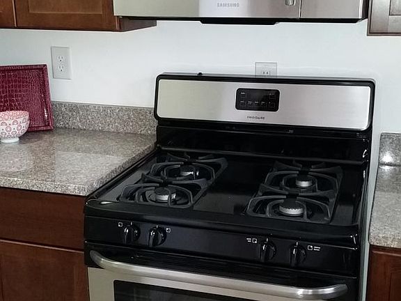 Kitchen with stainless appliances and granite counters