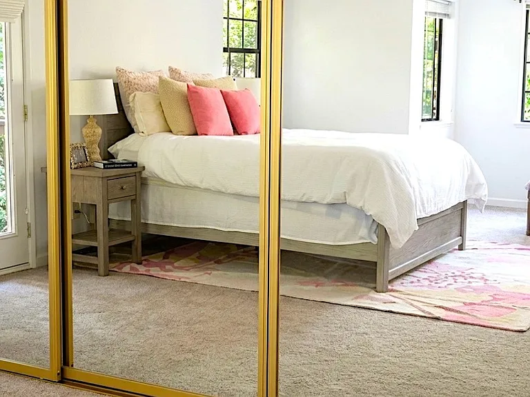 Master bedroom. Spacious with a walk in closet and a full closet behind the 3 panel sliding mirrors. Master bedroom has a private full bath with small deck off bathroom.