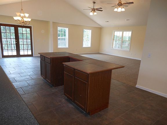 open room w/ vaulted ceiling