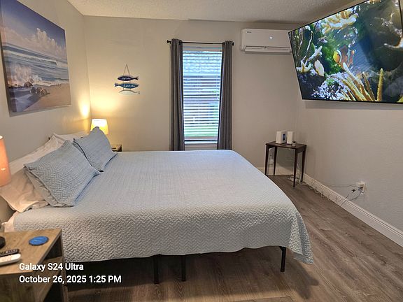 King super comfy bed, minisplit, Roku TV, closet, dresser, and shelving unit.