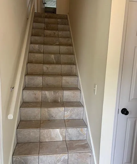 As you enter the front door, this stairway leads to the second level.