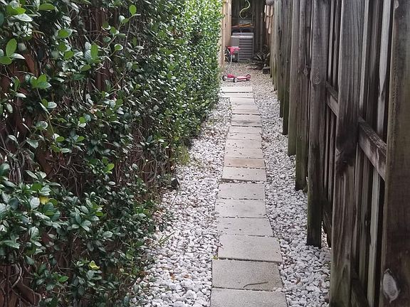 well manicured-illuminated entrance