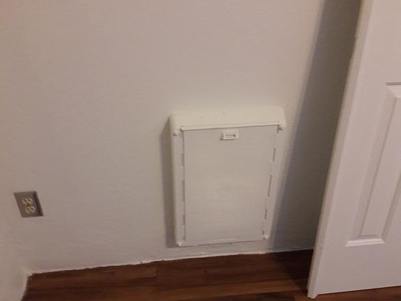 Side A Dog Door leads to yard outside of pool fence