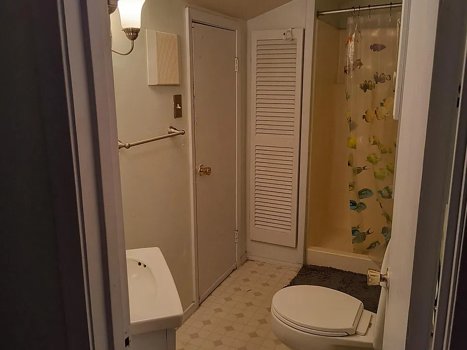Bathroom looking toward shower and closet