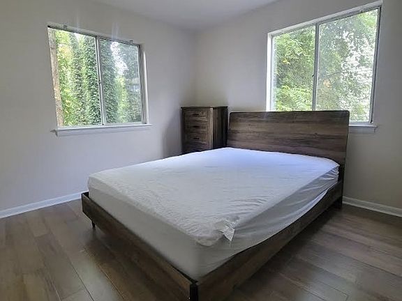 Furnished bedroom with tons of natural light.