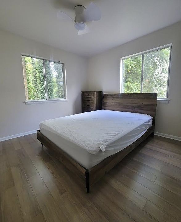 Furnished bedroom with tons of natural light.