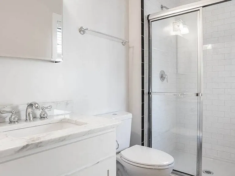 Bathroom with Ceramic Tile, Operable Window, and Walk-In Shower