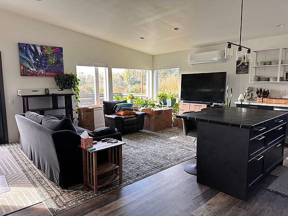 Living room with large island with drawers.