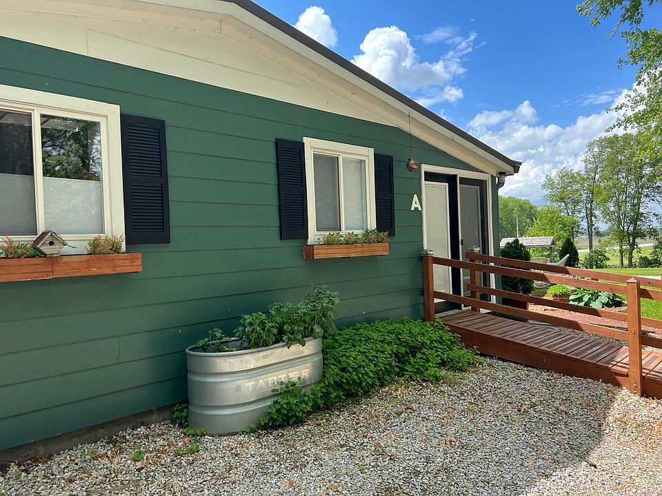 3201 Douglas Woods Dr. has a great country cottage feel.