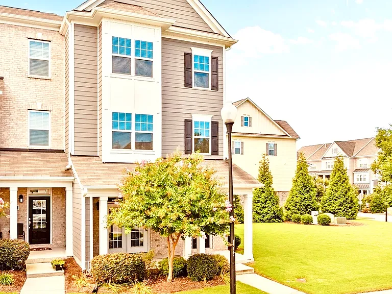 This townhome is spacious, perfectly located and tucked away in the back of this newer neighborhood. This end unit lets in a lot of natural light and great sunsets. View from your front porch or back deck. Short walk to community pool and playground.