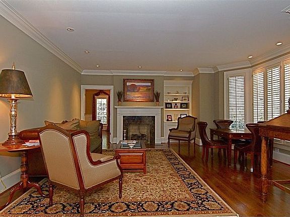 formal living room, gas fireplace, plantation shutters, crown moulding