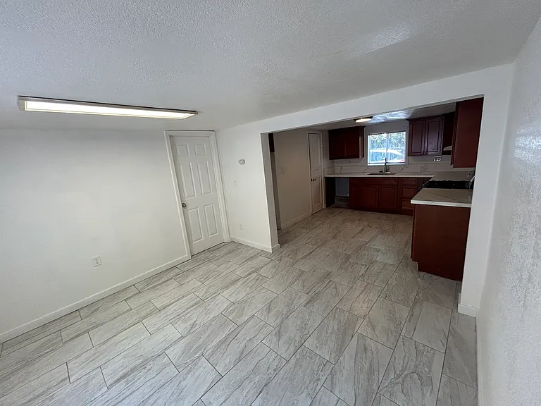Front Door to Kitchen/Bedroom Door.