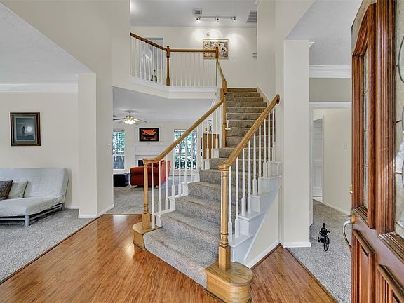 Formal living (or could be a study) on left of entrance; formal dining to the right.