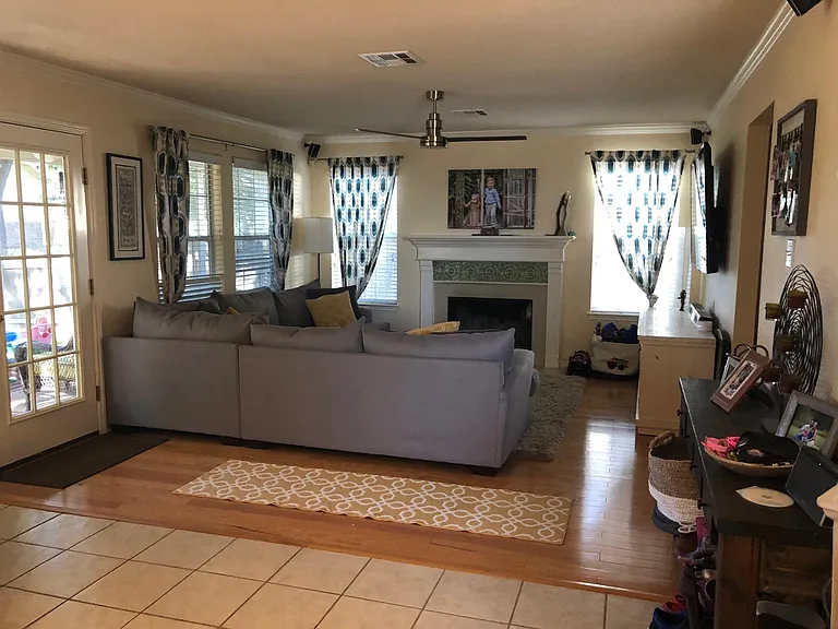 Door goes out to screened in porch and large size backyard with deck and fire pit.