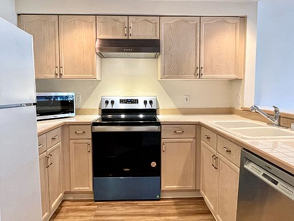 Brand new stainless stove and newer appliances.