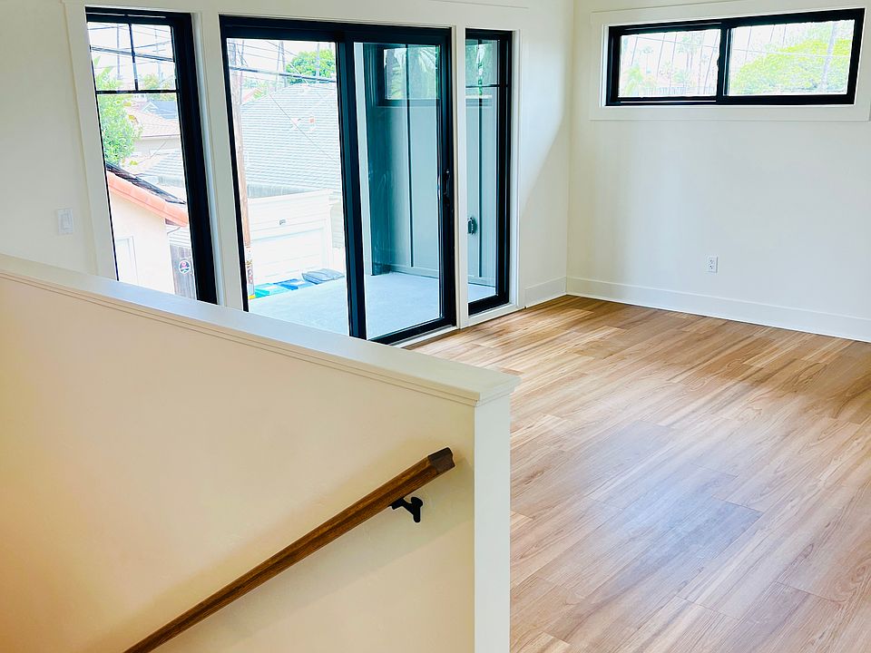 Entrance to ADU. Living area. Vaulted ceiling, private balcony.