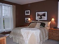 Large 1st floor master bedroom has double closets with closet maid systems