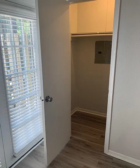 Extra deep closet next to the back patio french doors. Tons of storage room