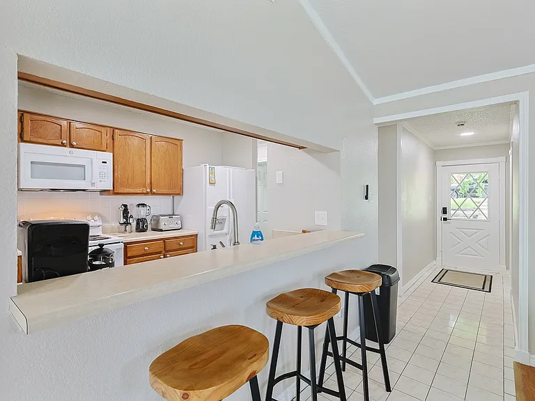 Full kitchen - fully stocked kitchen with counter space and barstools to seat 3.