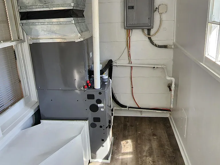 Back porch. Furnace is opposite of Washer/Dryer hookup.