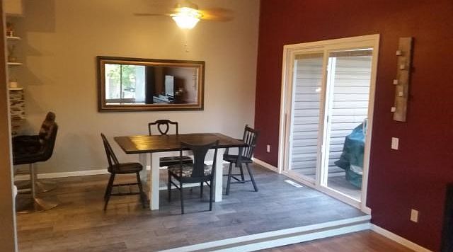 Dining room area.  There is a new patio door here too.  Check out the neat, built-in window blinds. Nice!!  Leads to an oversized deck - 20' x 10'.