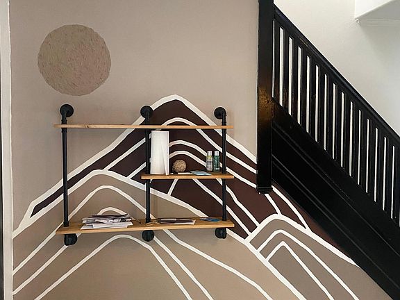 Custom, hand painted mountain mural in the dining room