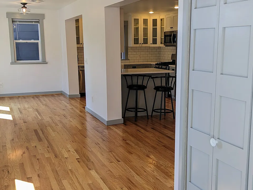 View from front door, entry closet, dining area, kitchen