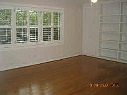 Handy built ins cover one wall of the living room.