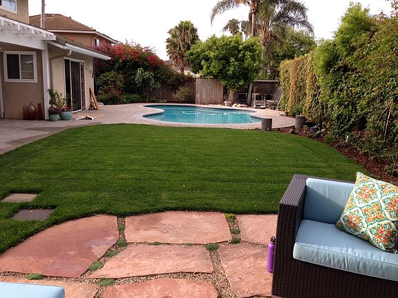 view toward pool from backyard seating area