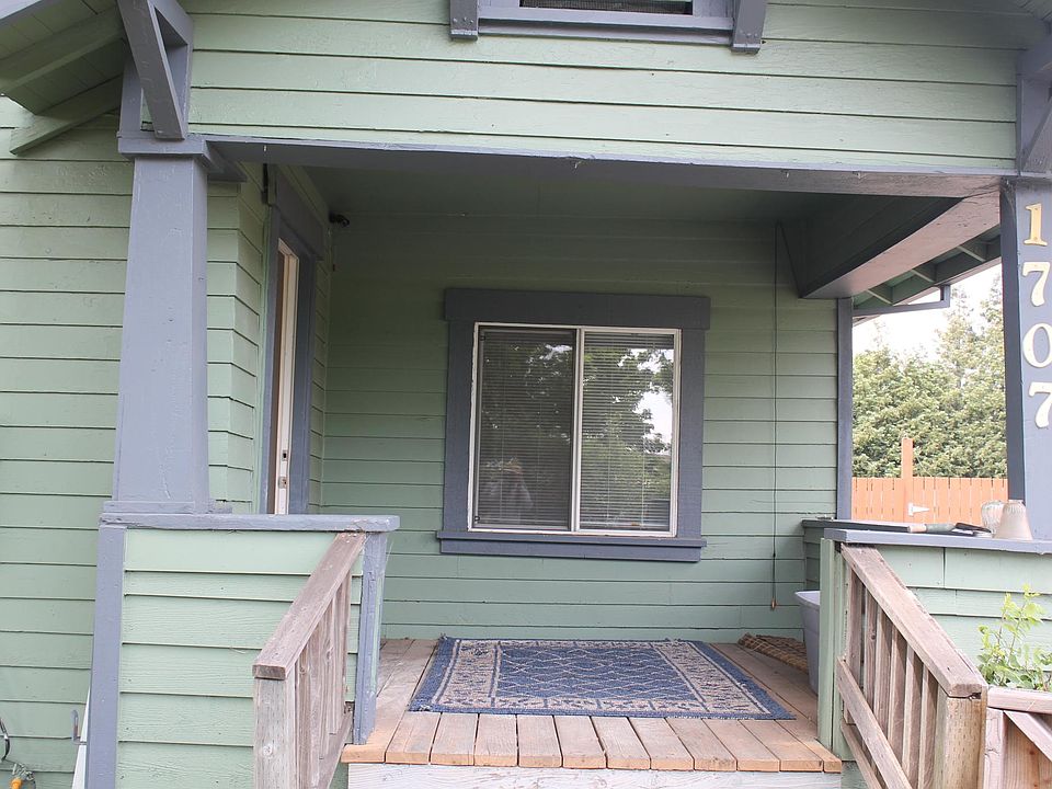 Shady front porch with view of park across the street