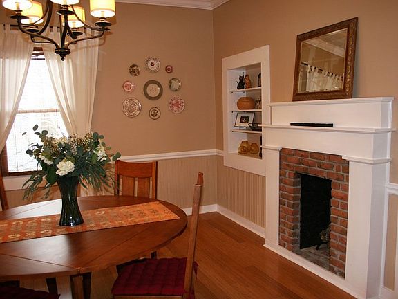 Spacious dining room w/fireplace.