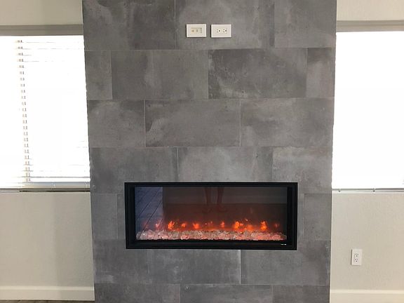 Modern Flame electric fireplace looks cool and can keep you