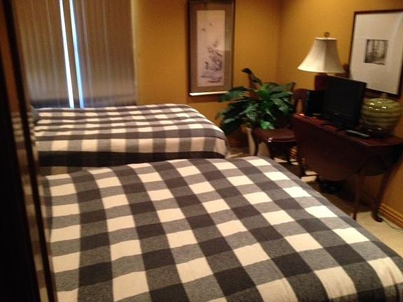 guest bedroom with two double beds