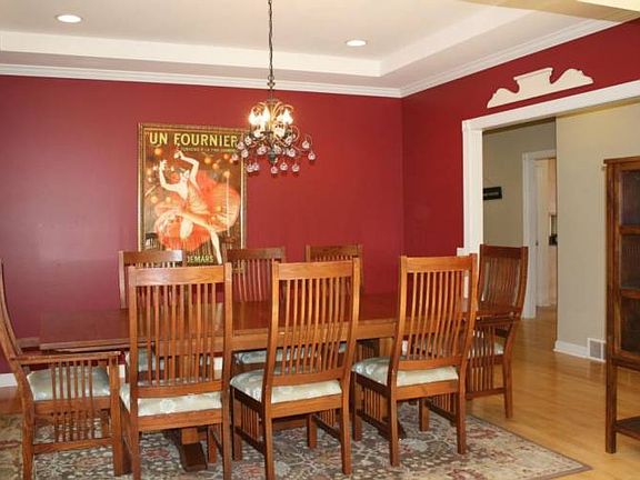 Large Formal dining room features tray ceiling and is located off the foyer and kitchen.