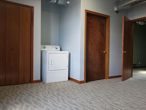 Entry area on the second floor with clothes dryer.