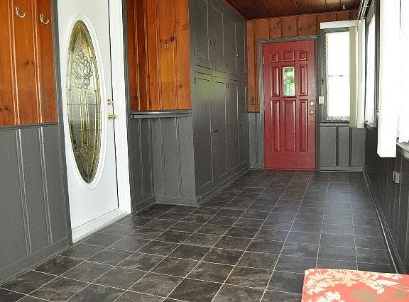 Left door to kitchen. Red door to driveway.