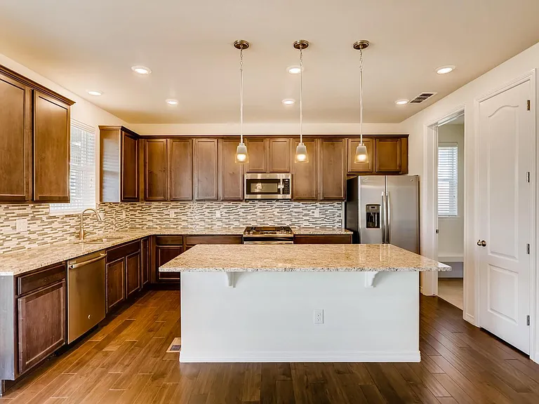 Huge island. Countless cabinets and large drawers.