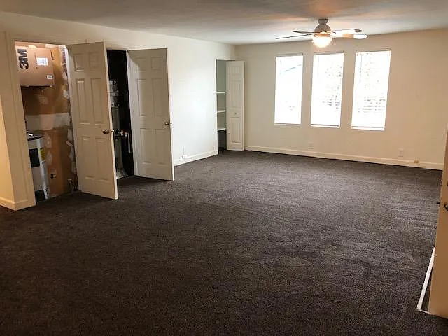 The first door to the left is where the water heater is. The second door is the furnace and the bi-fold door in the corner is more storage space.