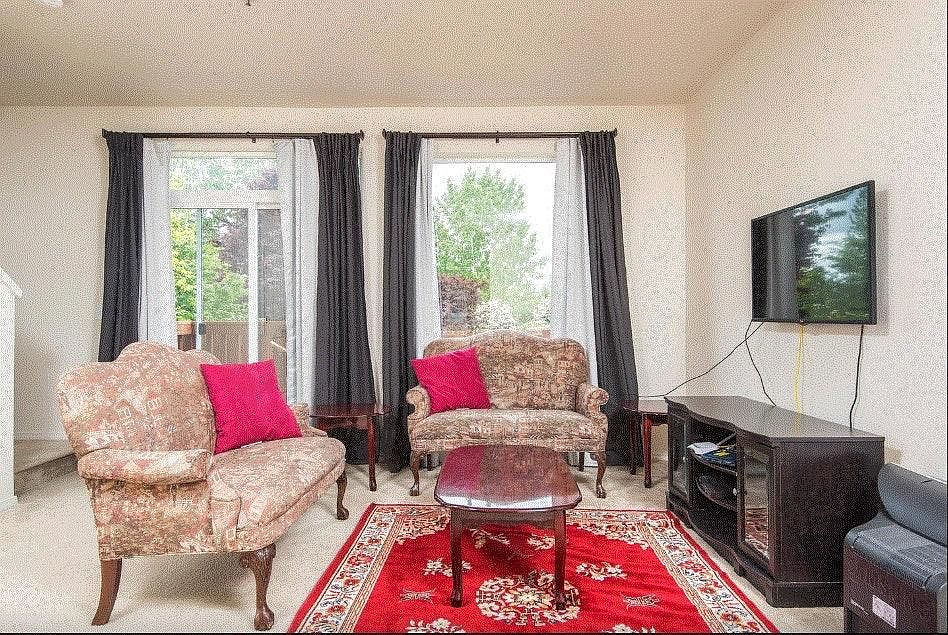 Family Room with a patio and a large window