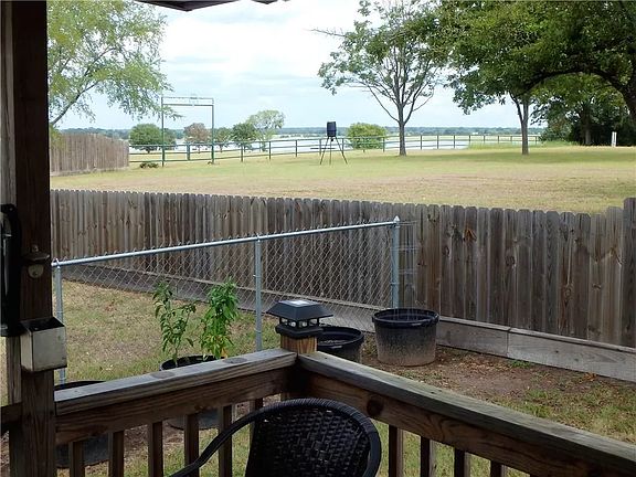 Short walk to the lake! Or relax and enjoy the view on the cozy back porch.