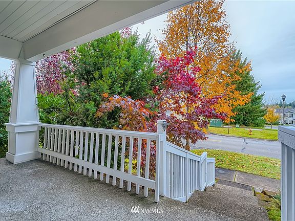 Enjoy sitting out on your great, spacious covered porch. Golf course and views just across the way.