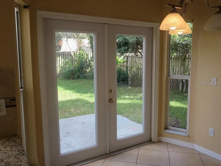 FRENCH DOORS LEAD TO BACK YARD