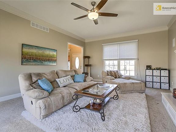 Great room features new carpet, fresh paint, and lots of light.