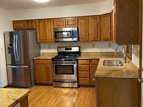 Kitchen #1 - Stainless steel appliances (gas stove, refrigerator, microwave and dishwasher), granite countertops, and lots of cabinet space.