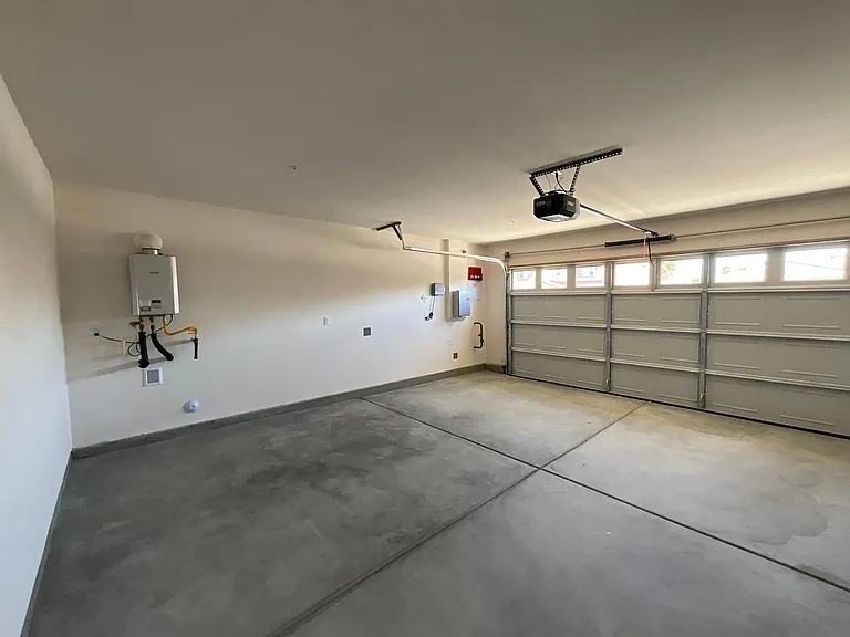 Garage with tankless water heater and solar