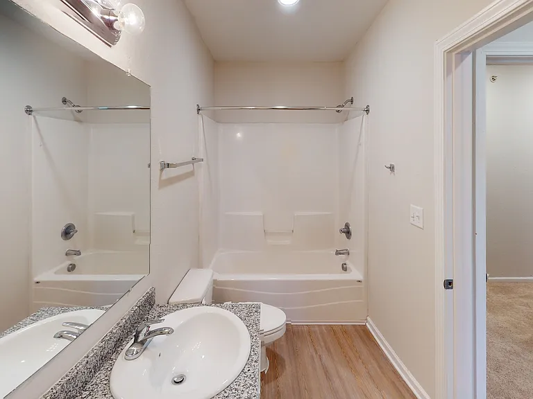 Modern Bathroom with Granite Vanity at Ralston Apartments in Downtown Indianapolis